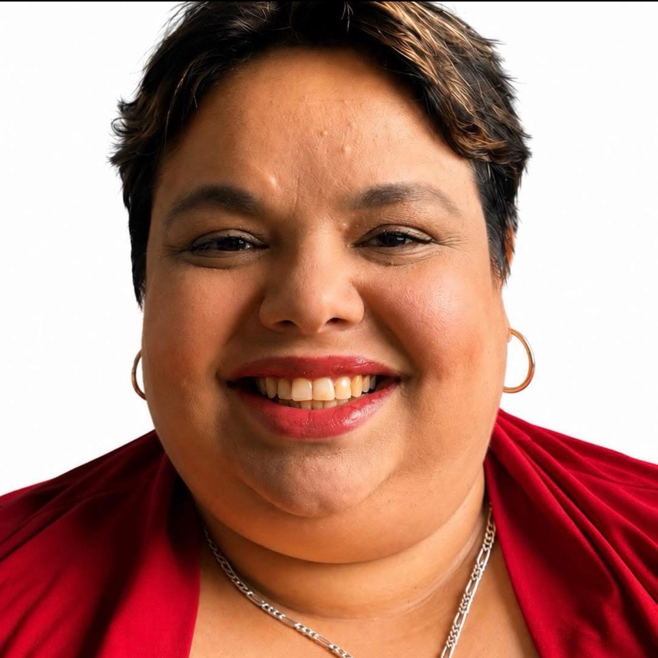 Head-and-shoulders portrait of Susel Munoz Plasencia, short dark hair, wearing a red top and gold earrings.