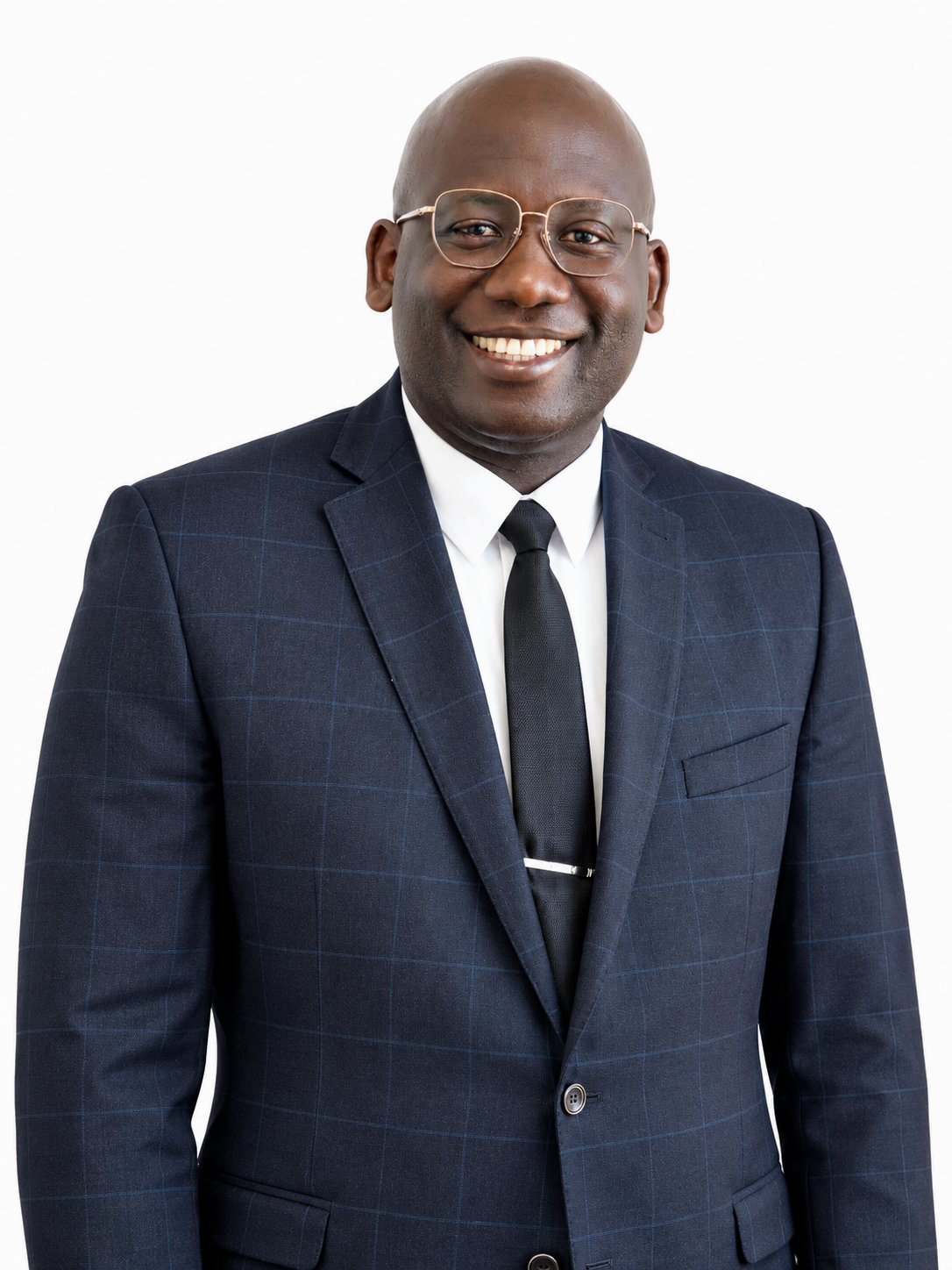 Head-and-shoulders portrait of Alton Frederick, wearing a grey suit and a dark tie.